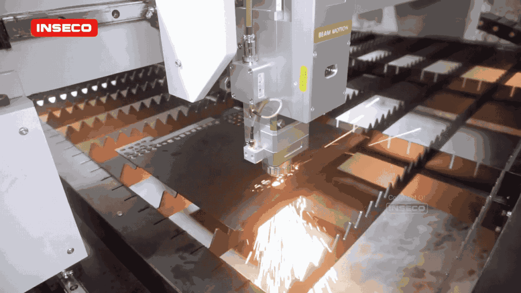 Mesin laser cutting INSECO memotong plat logam dengan presisi tinggi menghasilkan percikan api